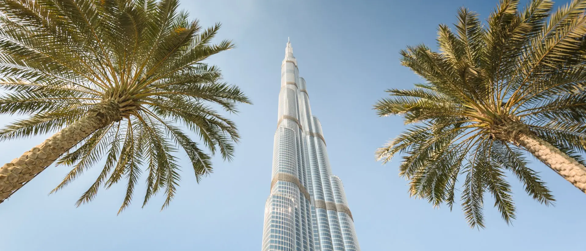 Low angle view of the Burj Khalifa in the city of Dubai on downtown dubai district. the Burj Khalifa tower is the tallest building in the middle east. Sunny day.