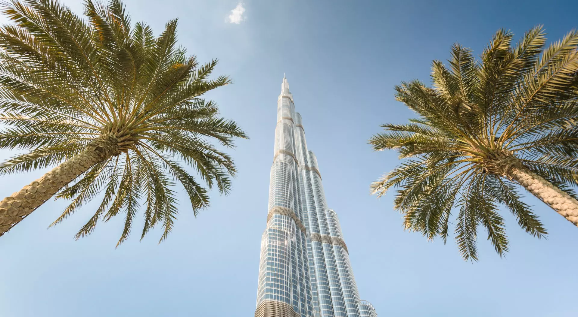Low angle view of the Burj Khalifa in the city of Dubai on downtown dubai district. the Burj Khalifa tower is the tallest building in the middle east. Sunny day.