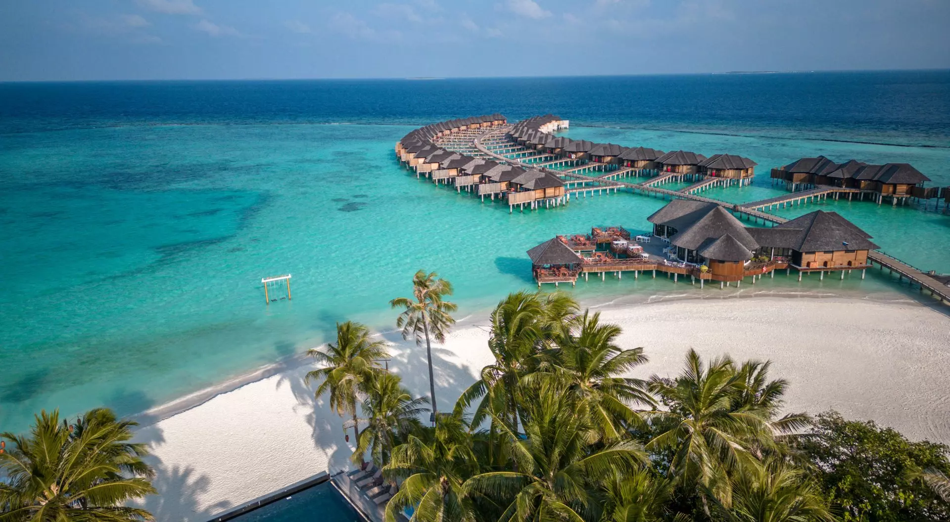 Maldives Maldives hotel beach resort on tropical Island with aerial drone view