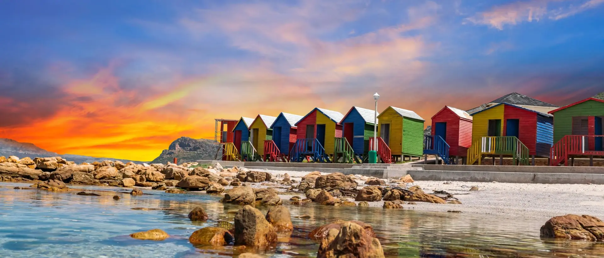 Muizenberg beach huts wooden cabins at twilight in Cape Town South Africa