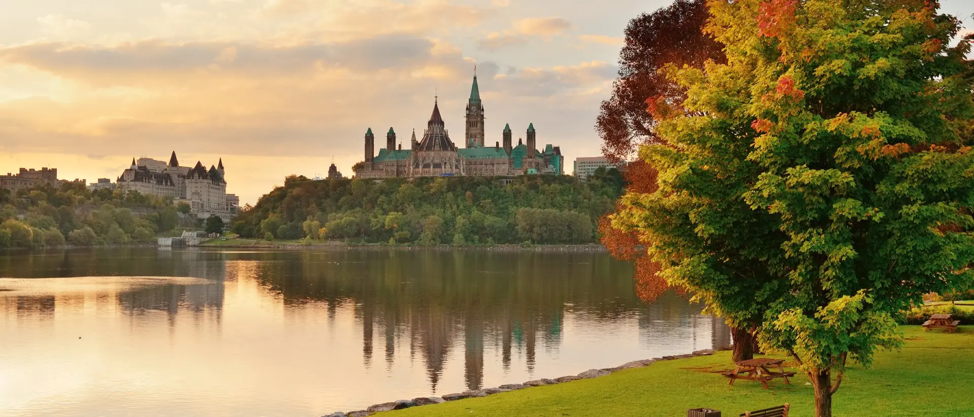 Parliament Hill, Ontario Ottawa city skyline with Parliament Hill at sunrise in the morning park view over river