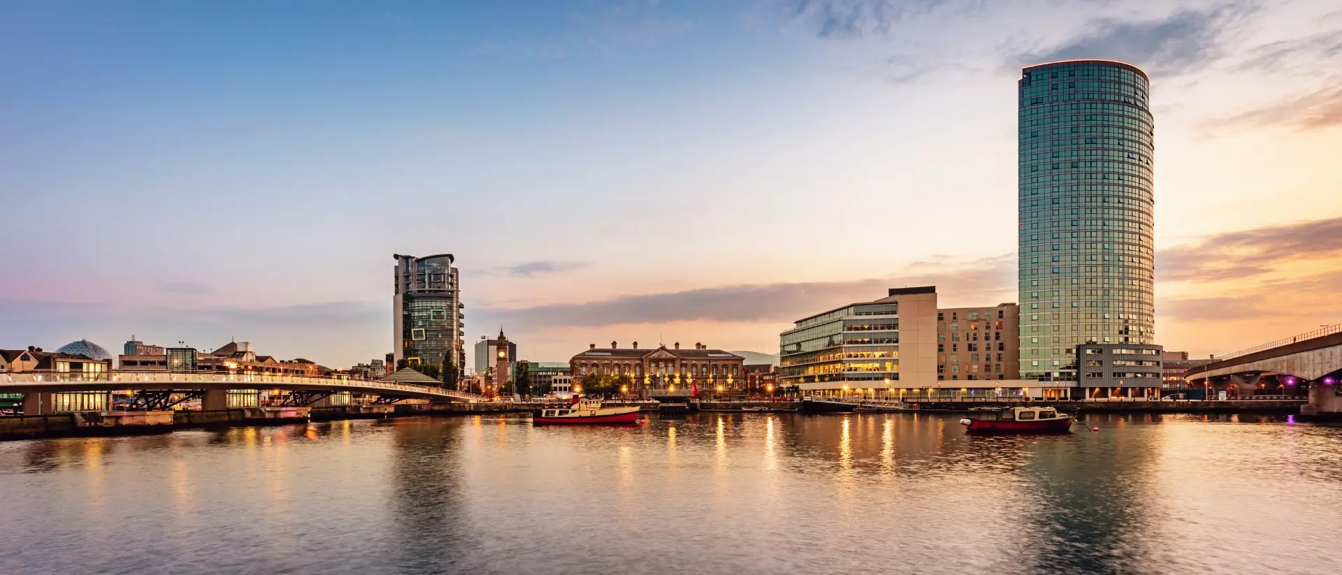 Panorama of Belfast River Lagan Waterfront Cityscape and Lagan Bridge at Sunset Twilight