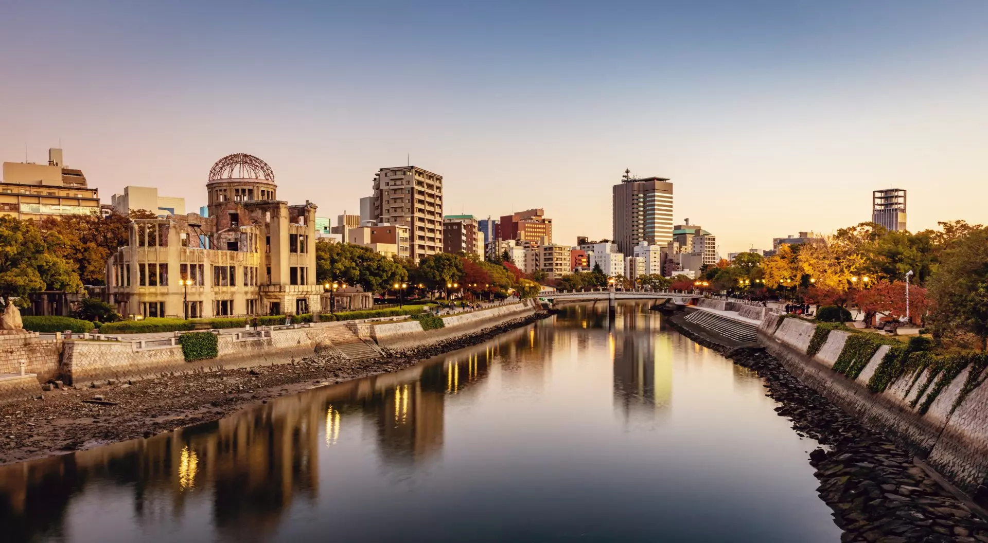Honshu Panorama of Hiroshima Cityscape at Twilight. View over the Ota River, Atomic Bomb Dome illuminated on the left side of the river