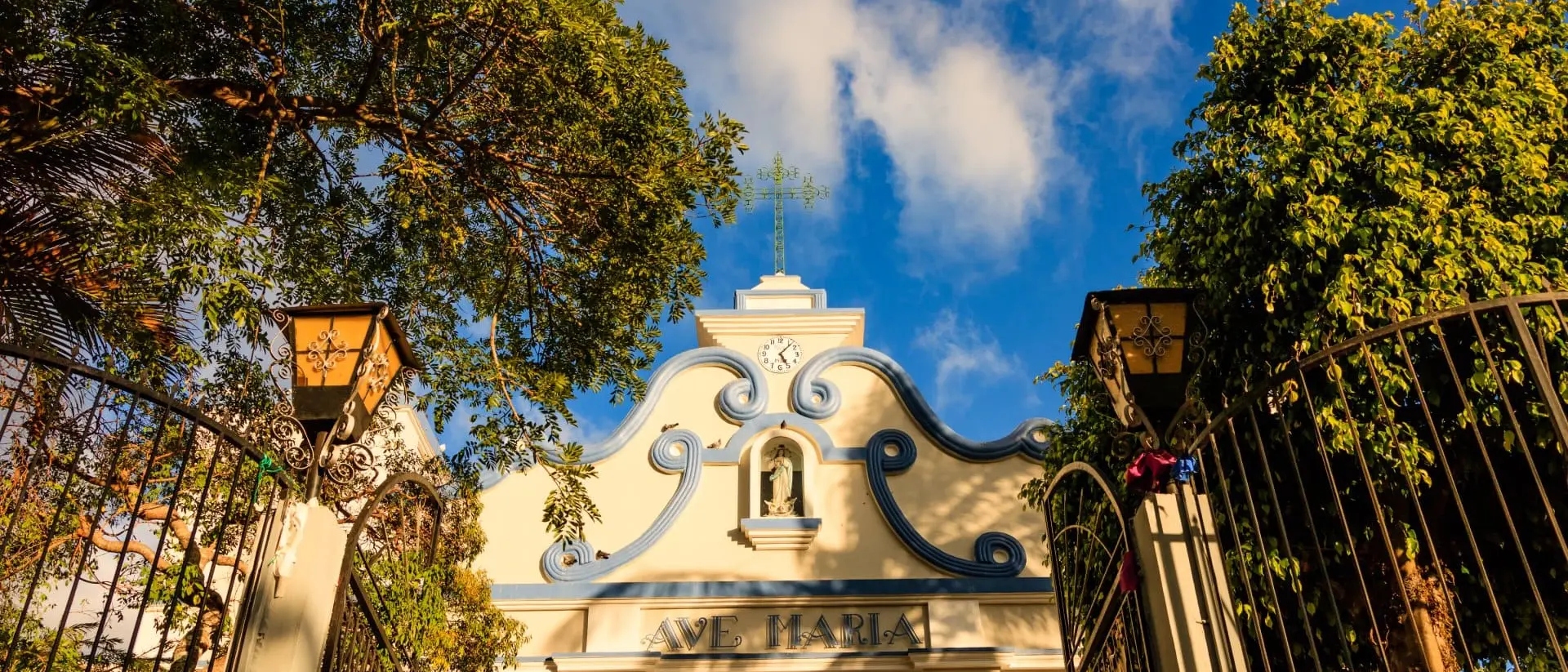 El Salvador Sun shining over a small village colonial cathedral in El Salvador, Central America