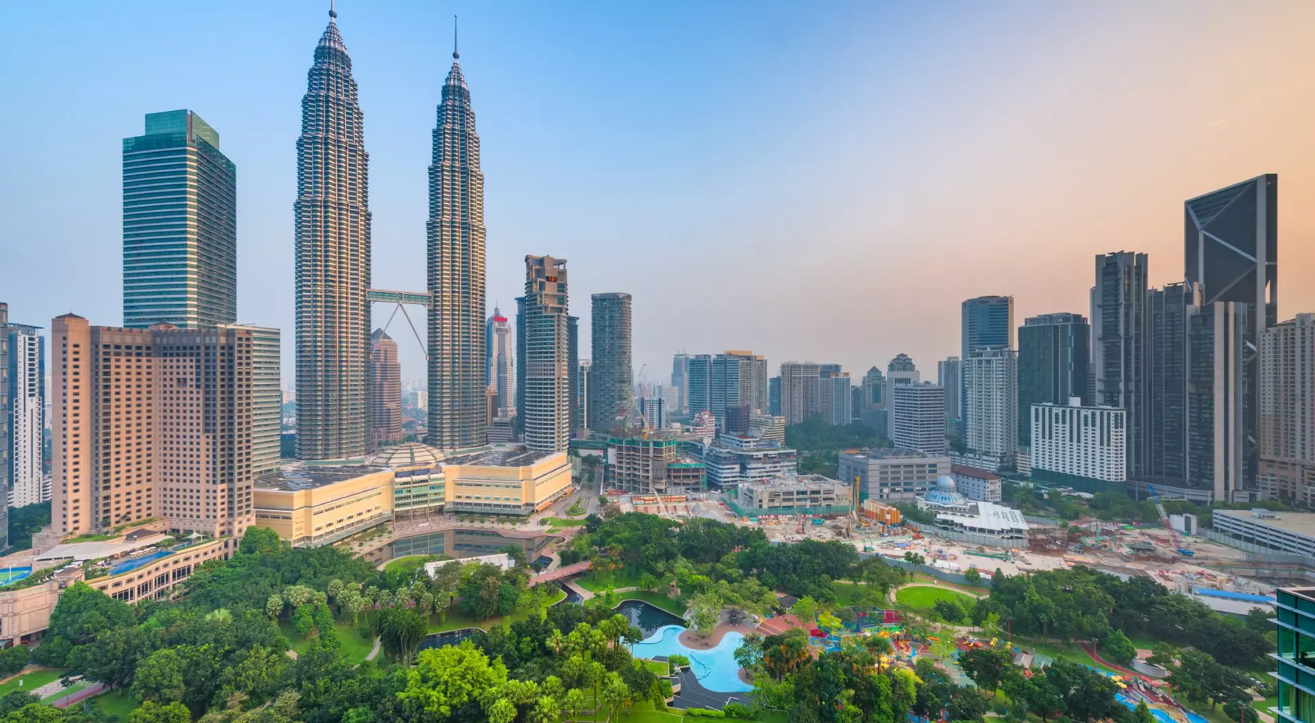 Petronas Twin Towers Sunset skyline view of Kuala Lumpur featuring the Petronas Twin Towers, an interlinked pair of 88-storey skyscrapers