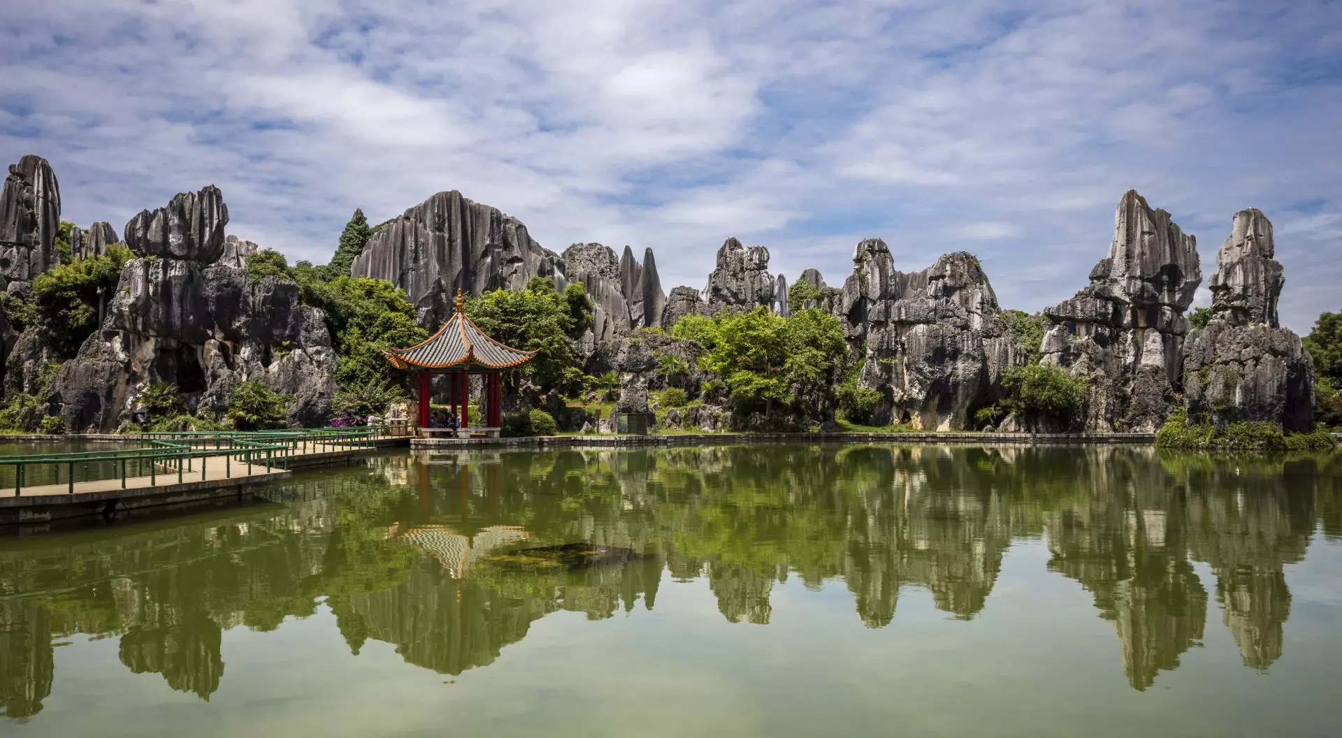 The Stone Forest or Shilin is a notable set of tall limestone formations that seem to arise from the ground looking like petrified trees