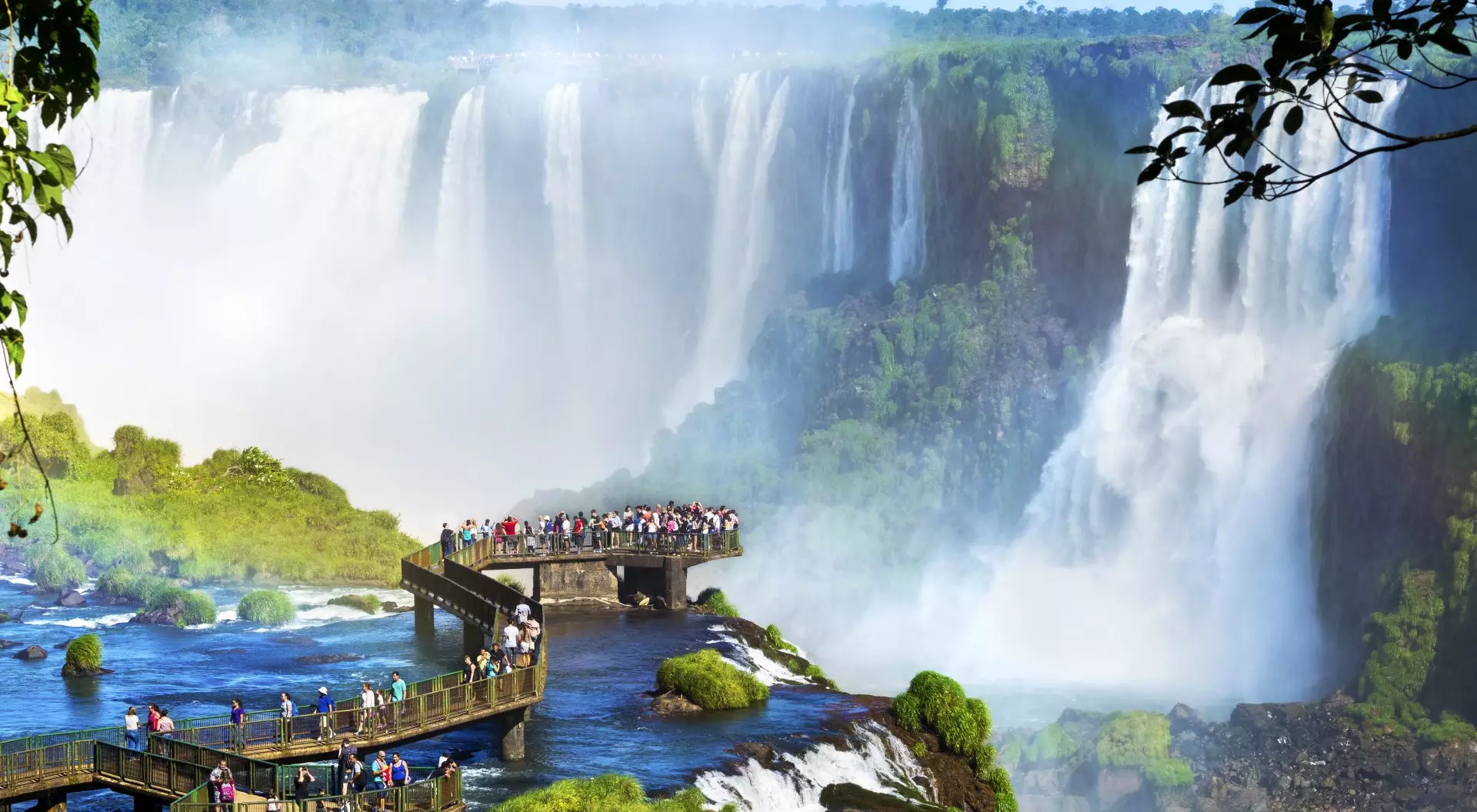 Iguazu Falls Tourists at Iguazu Falls, one of the world's great natural wonders, on the border of Brazil and Argentina.
