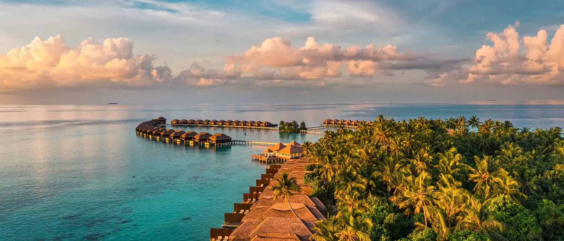Aerial view of bungalows over the ocean in the Maldives