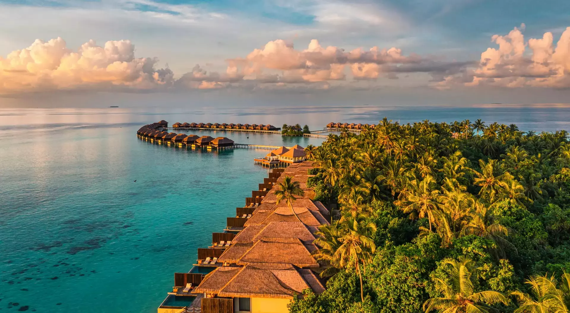 Aerial view of bungalows over the ocean in the Maldives