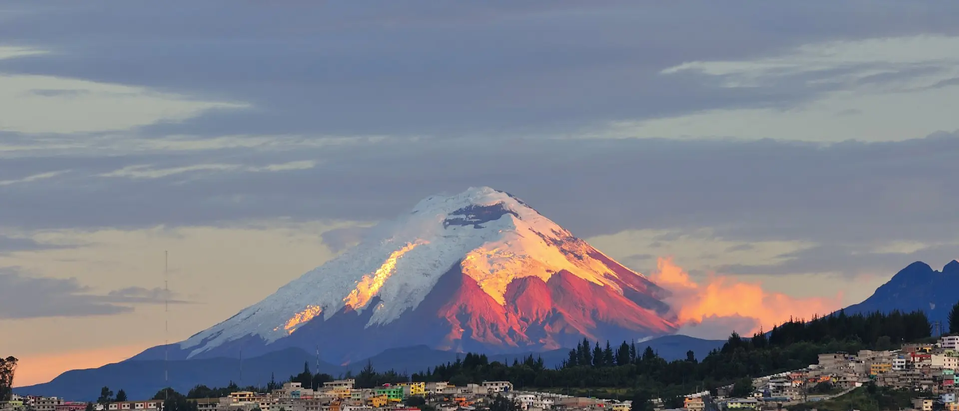 The last rays of sunlight illuminate the Cotopaxi Volcano
