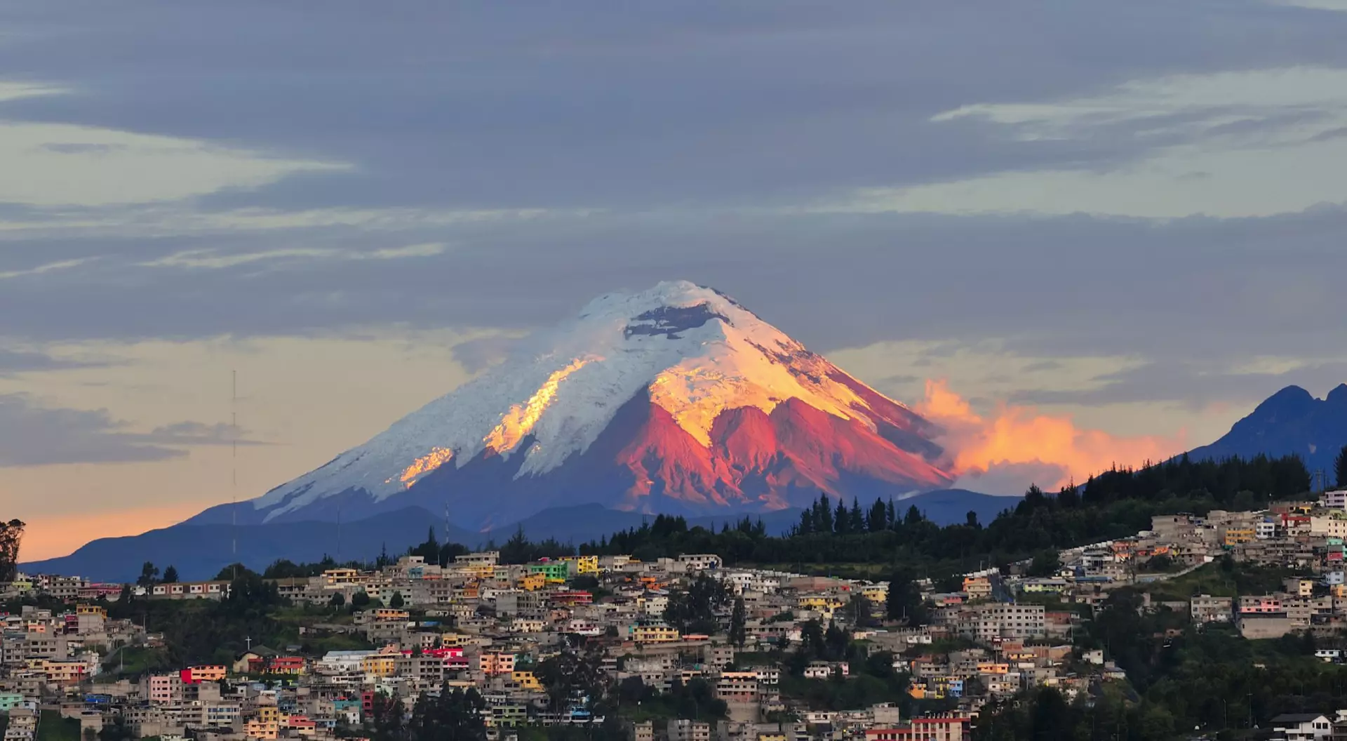 The last rays of sunlight illuminate the Cotopaxi Volcano