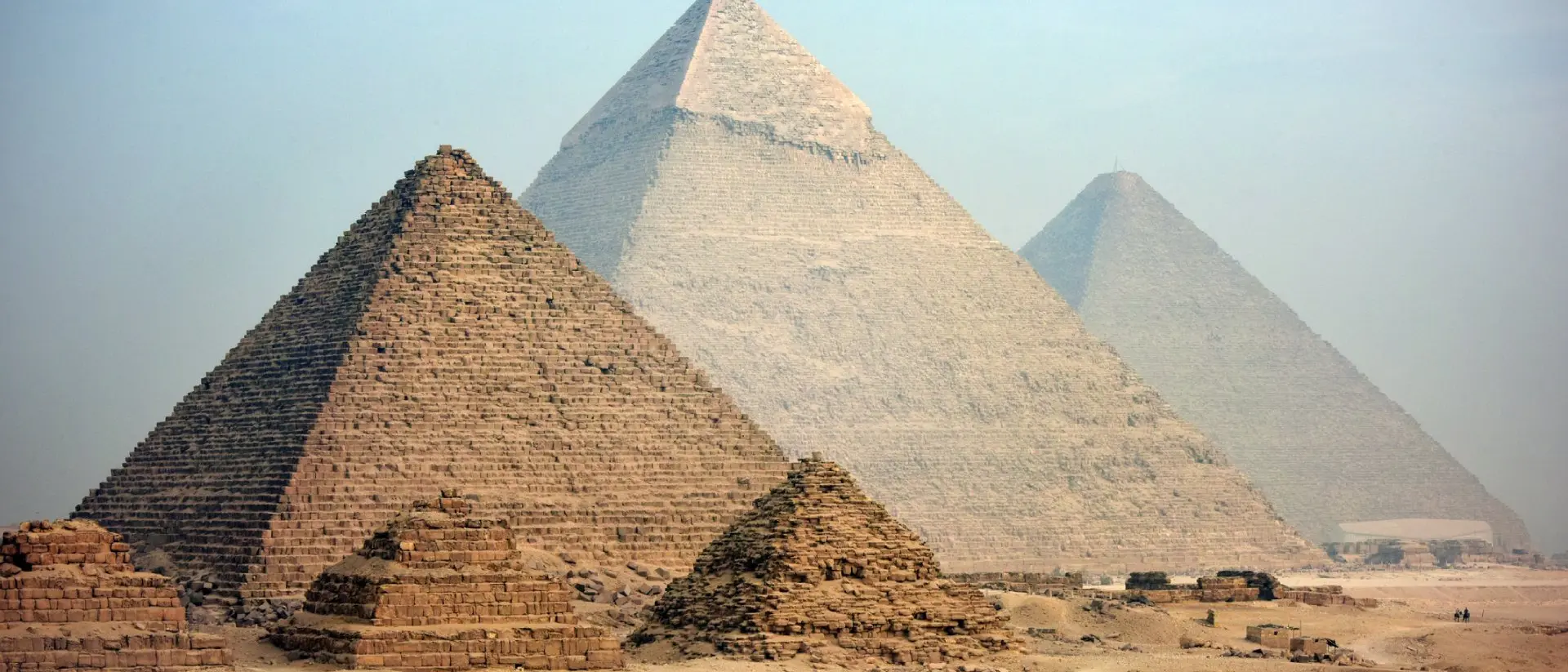 Majestic pyramids at Giza in Cairo at dusk.