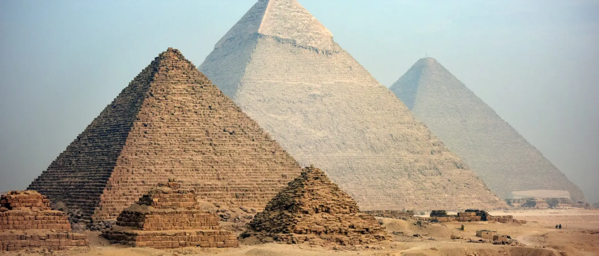 Majestic pyramids at Giza in Cairo at dusk.