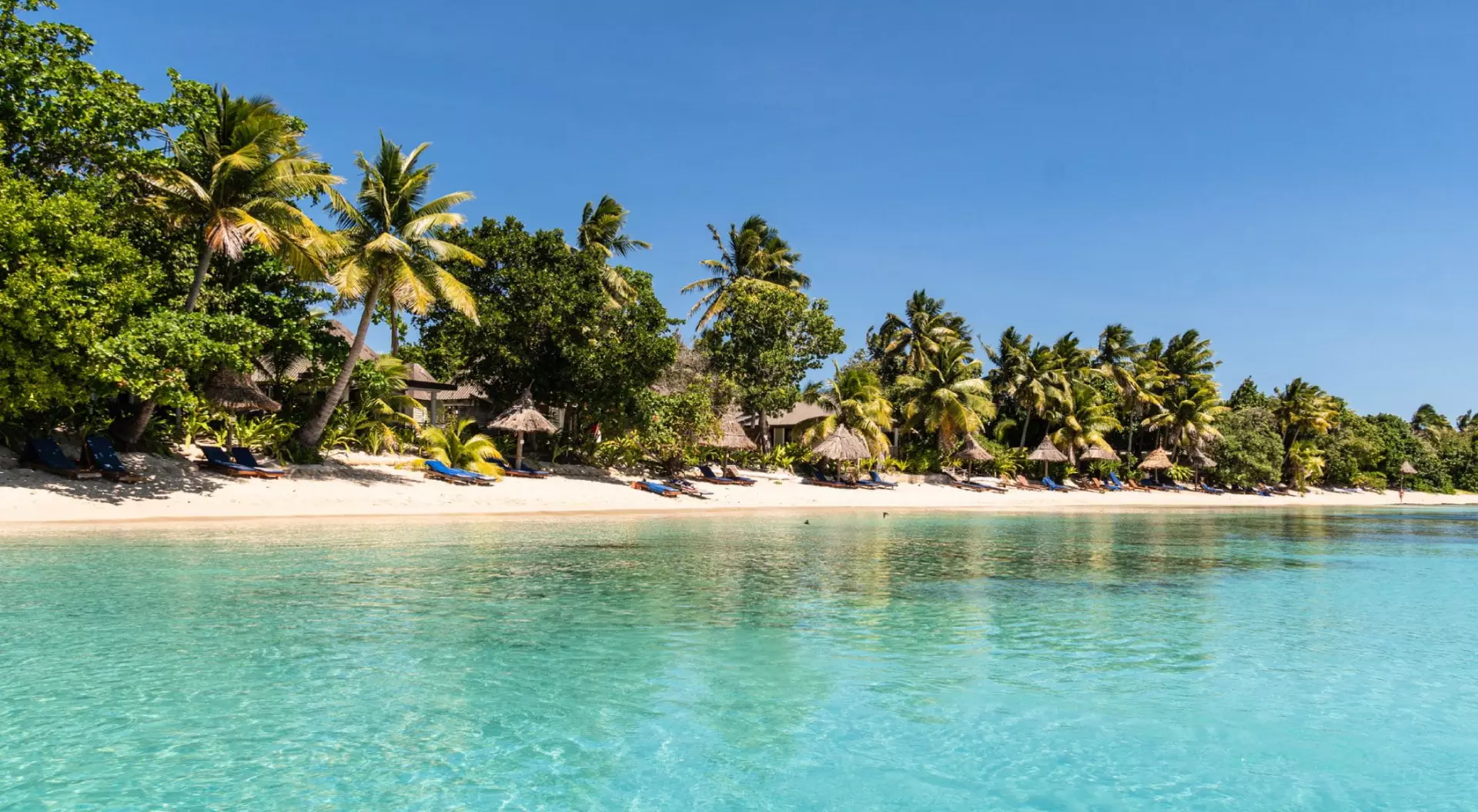 Idyllic turquoise water by an exotic beach in the Yasawa island