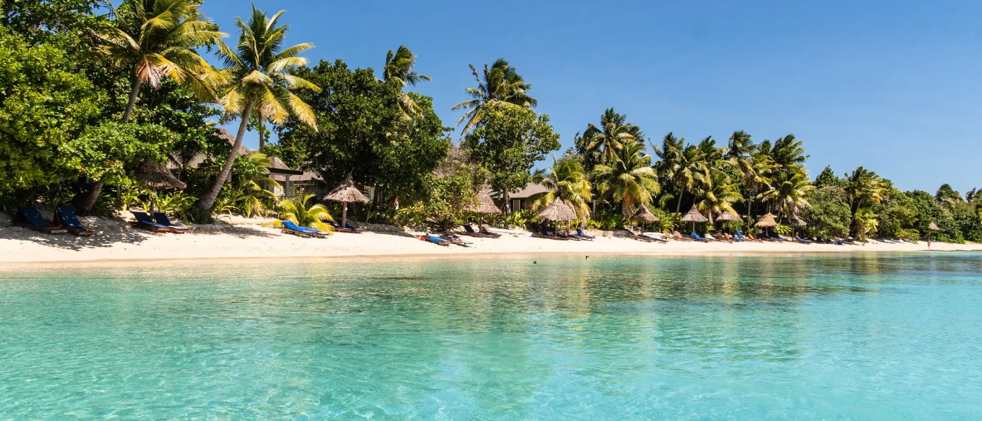Idyllic turquoise water by an exotic beach in the Yasawa island