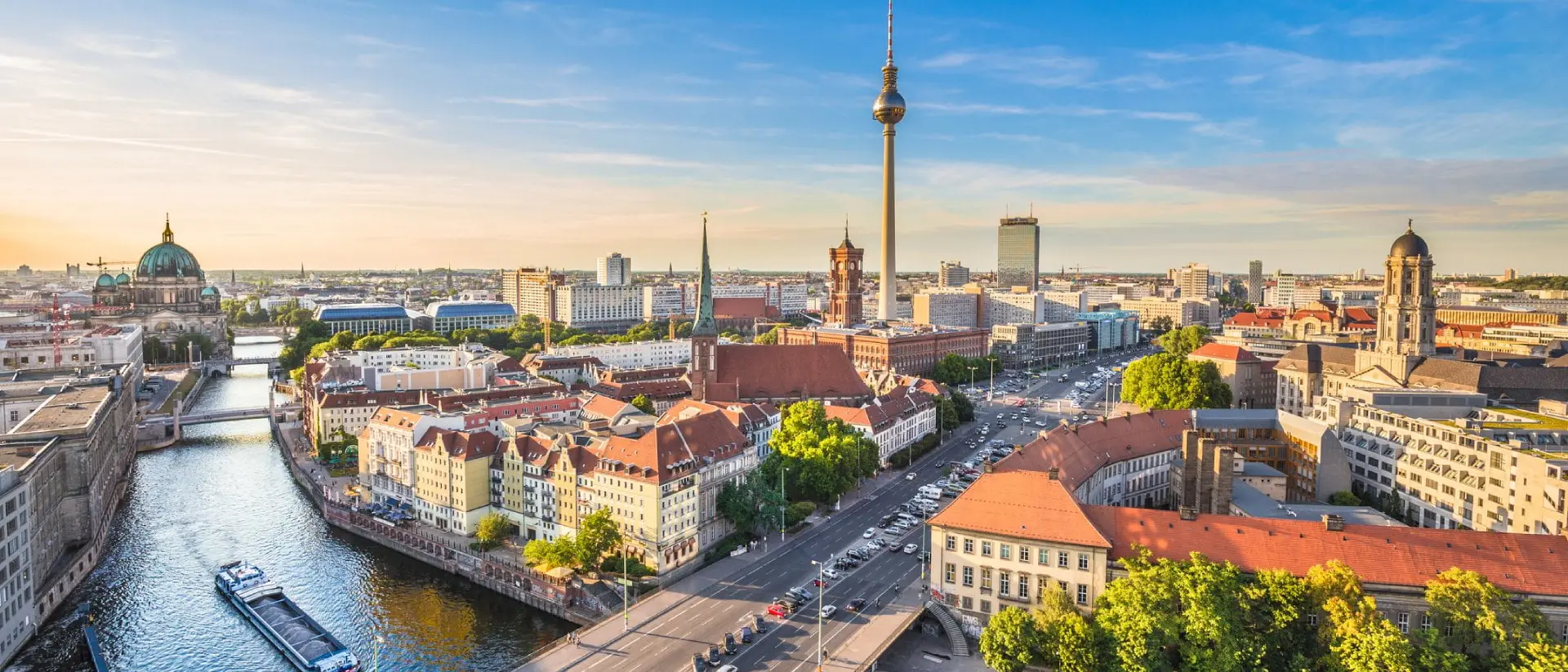 Berlin skyline with Spree river at sunset.