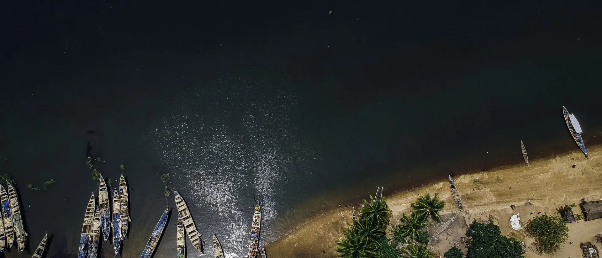 Aerial view of fishing boats at the shores of Ada in Ghana.