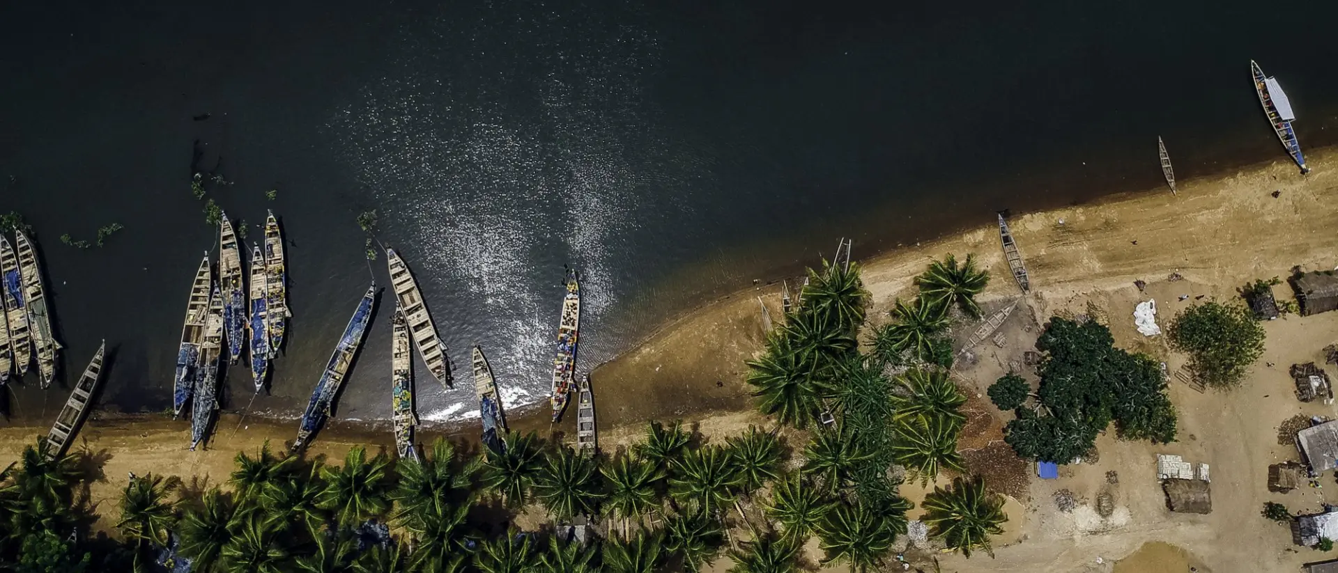 Aerial view of fishing boats at the shores of Ada in Ghana.