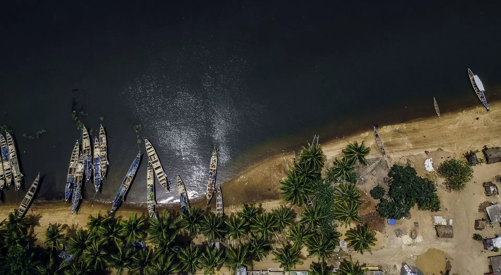 Aerial view of fishing boats at the shores of Ada in Ghana.