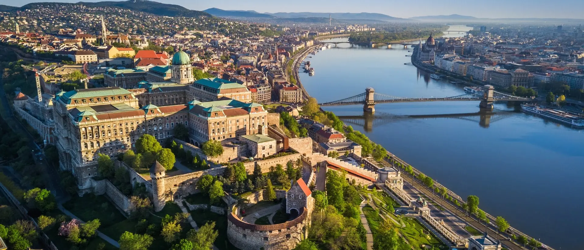 Beautiful aerial skyline view of Budapest at sunrise with Szechenyi Chain Bridge over River Danube, Matthias Church and Parliament