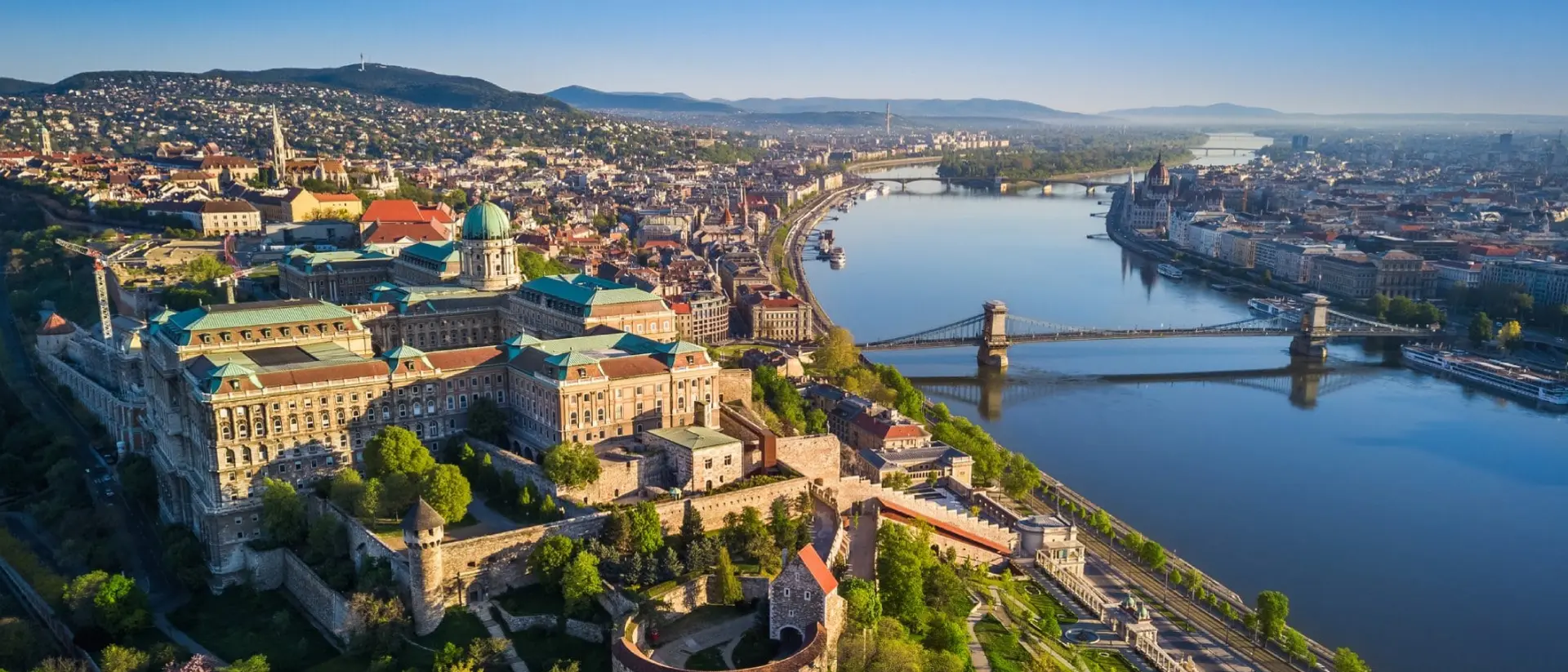 Beautiful aerial skyline view of Budapest at sunrise with Szechenyi Chain Bridge over River Danube, Matthias Church and Parliament