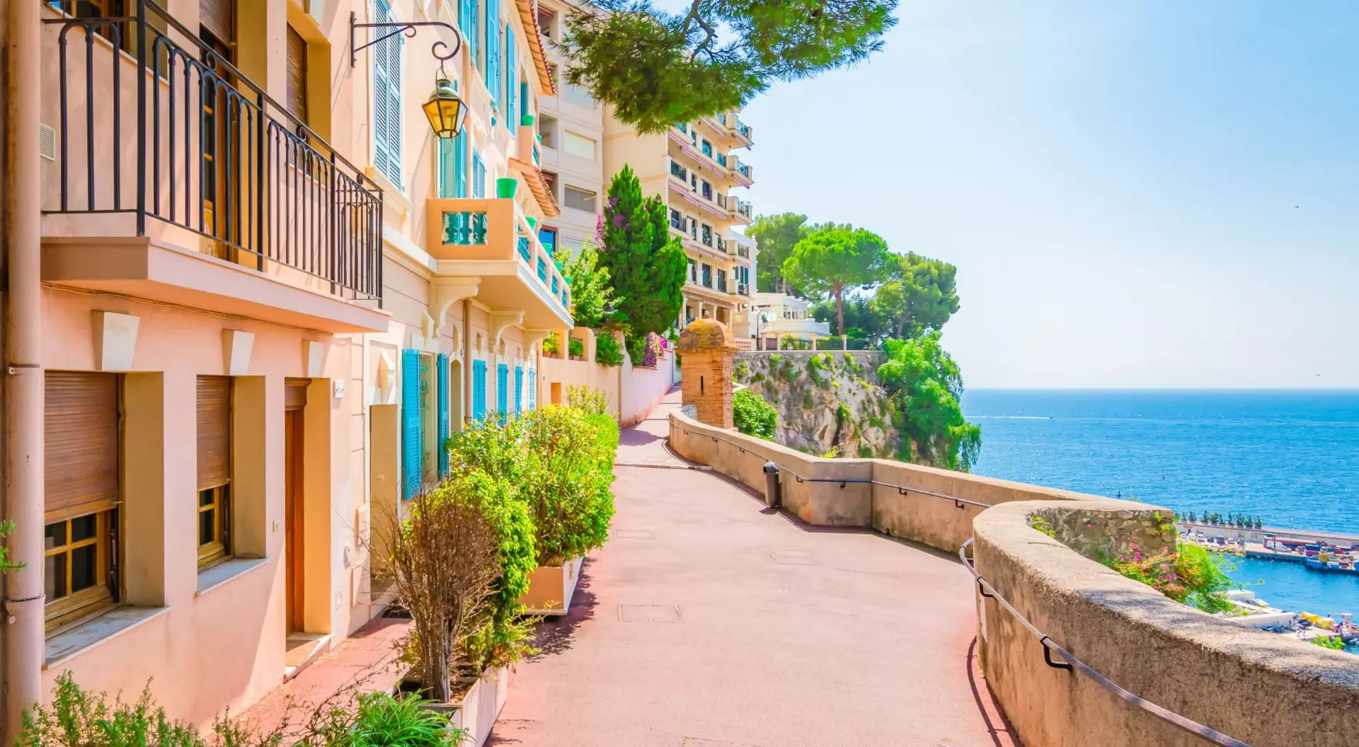 Typical walking street with colorful houses along the seaside of Monaco