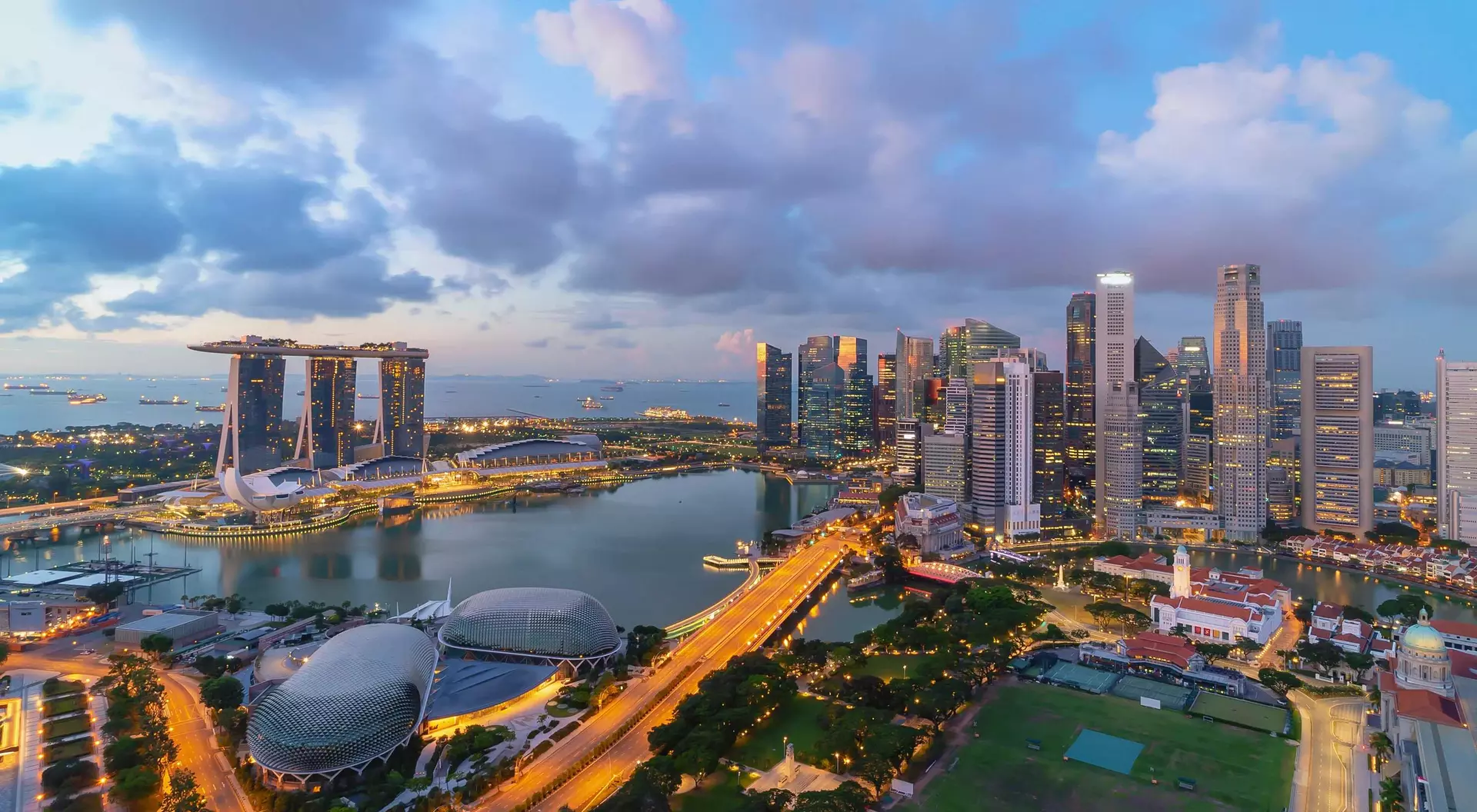 Singapore landmark city skyline, with iconic three tower Marina Bay Sands, during sunrise