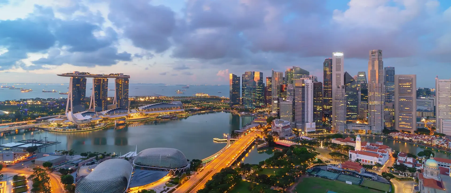 Singapore landmark city skyline, with iconic three tower Marina Bay Sands, during sunrise