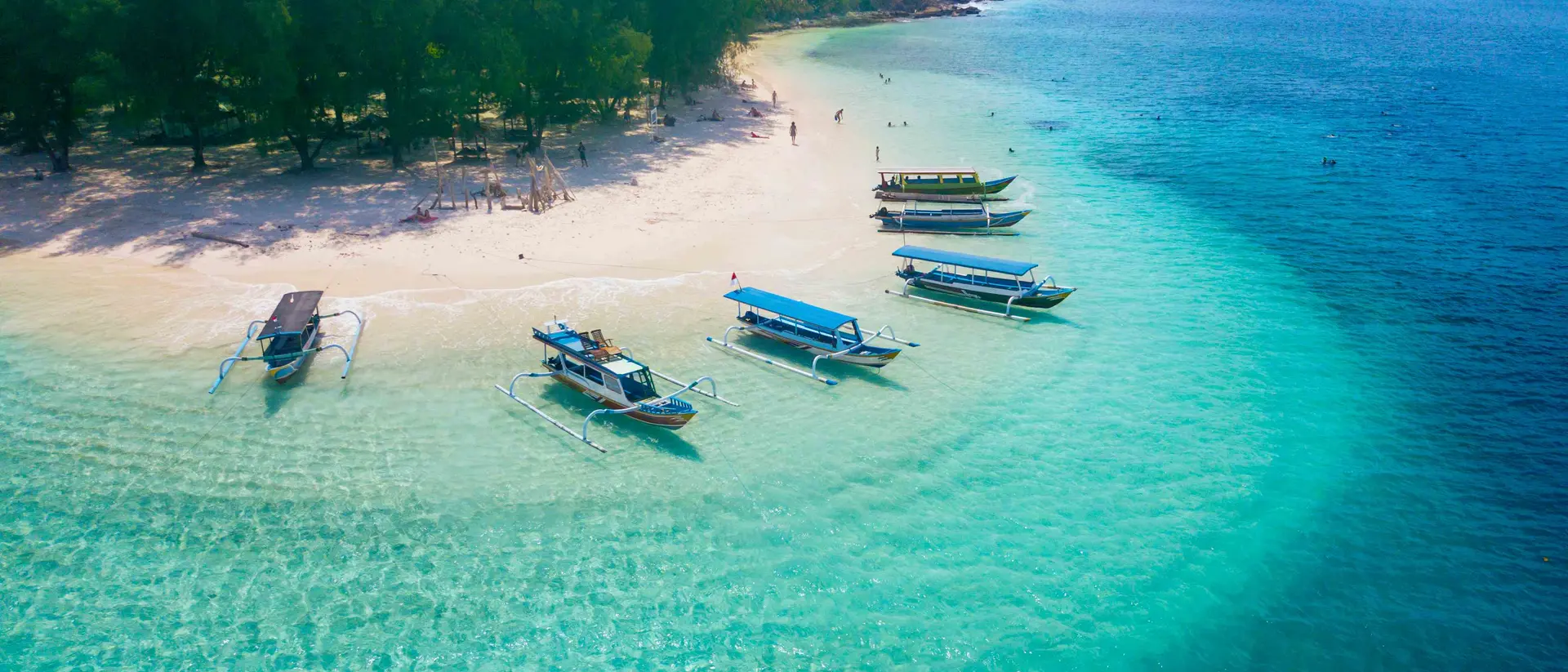 Gili Rengit Beach, Lombok Island Image of tourist ships anchored on the beach