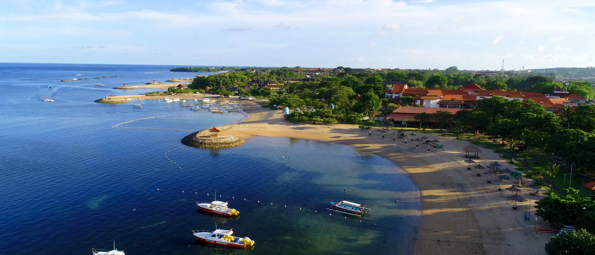 Beautiful aerial view of Tanjung Benoa Beach with boats in the water