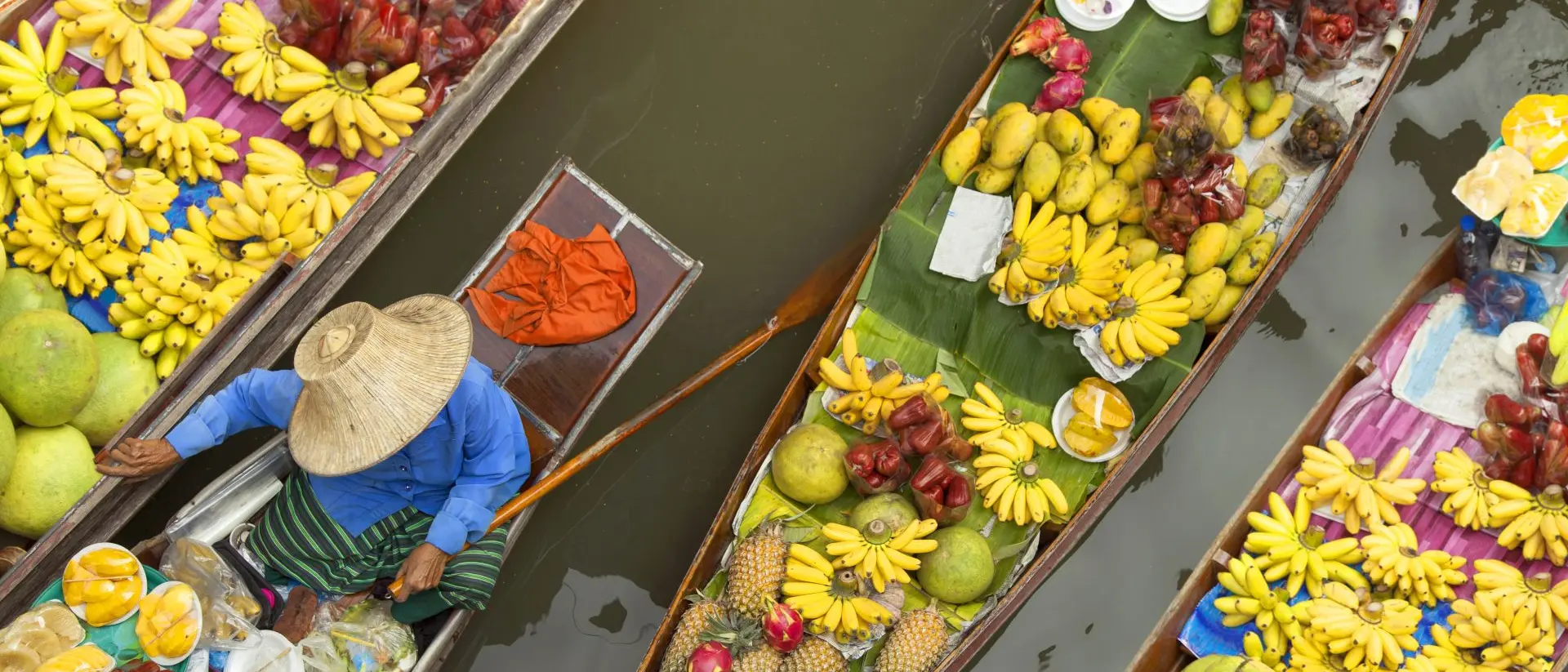 Bangkok Floating market, boats filled with fruits and vegetables, in Bangkok, Thailand