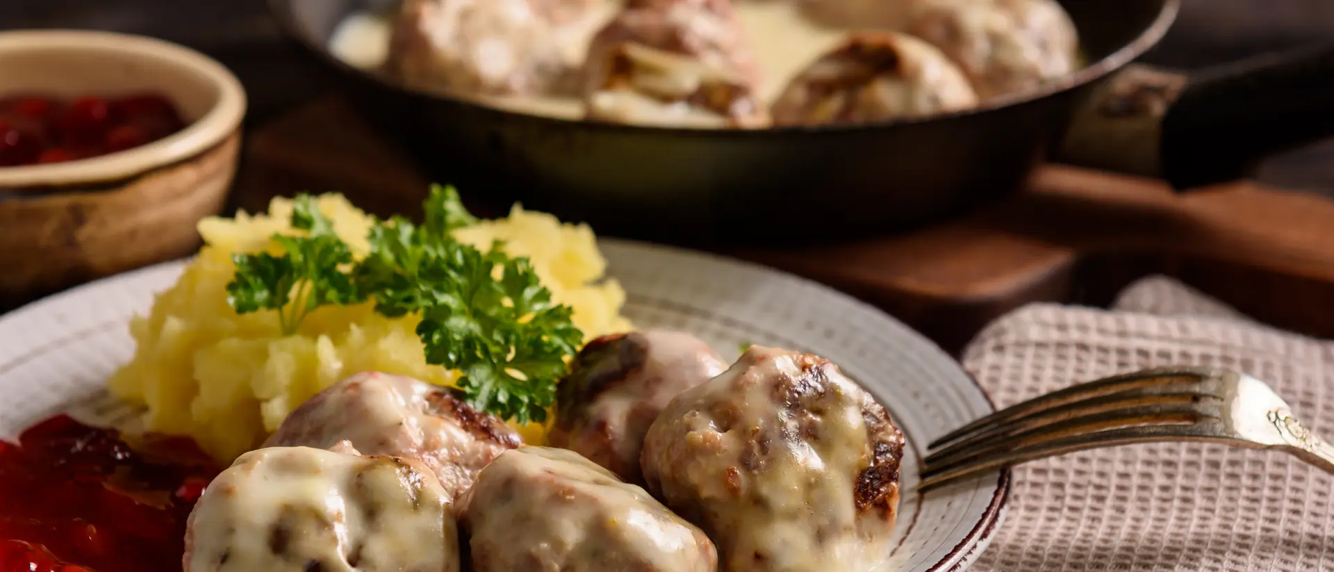 Swedish meatballs with creamy gravy, mashed potatoes and lingonberry sauce.