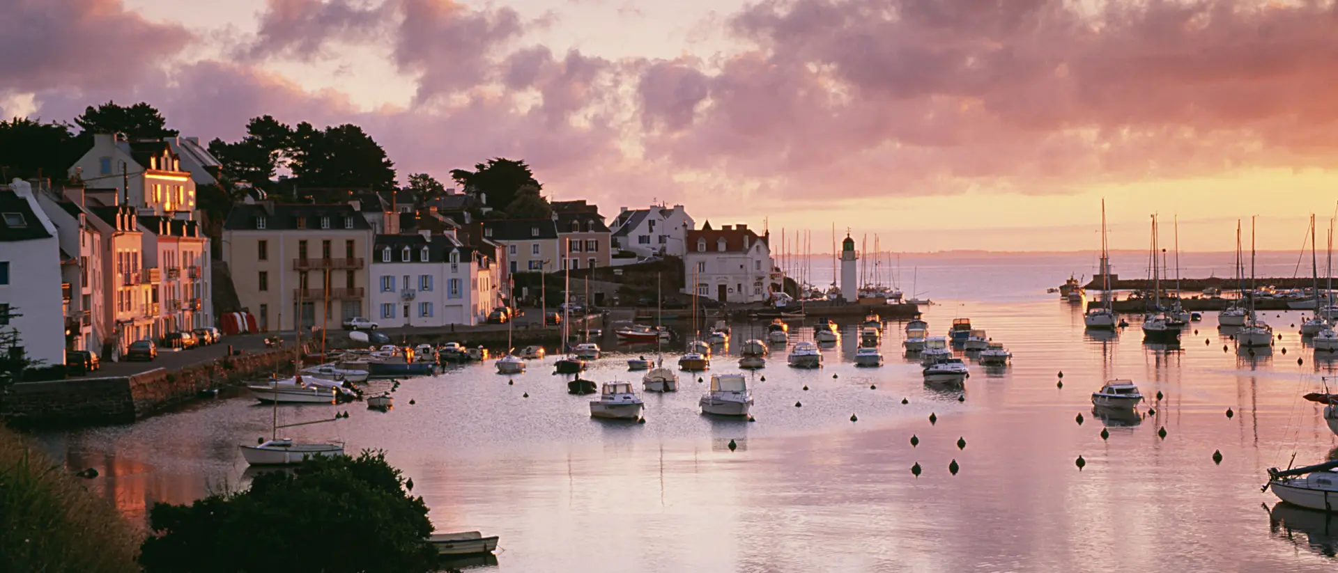 Harbour with boats in the water at sunset