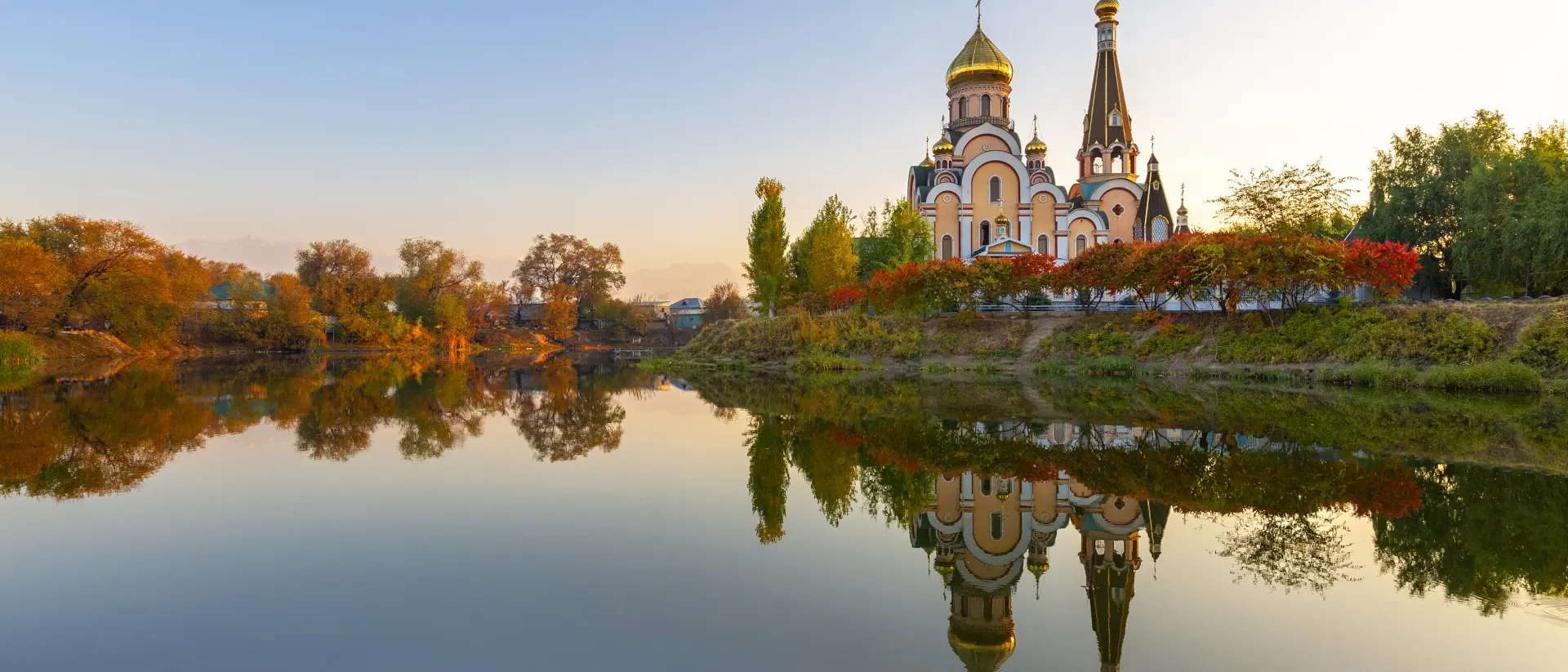 Russian orthodox church and its reflection, at the sunset in Almaty, Kazakhstan