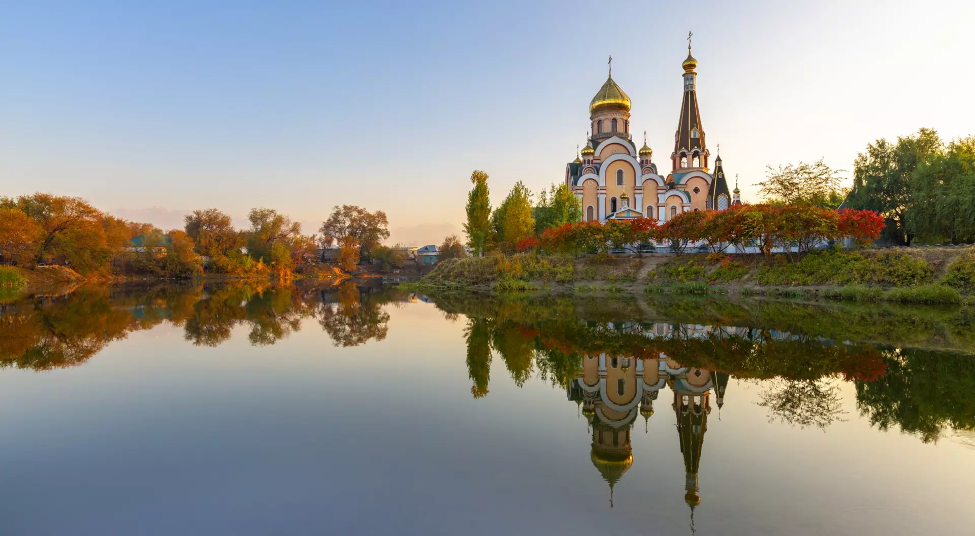 Russian orthodox church and its reflection, at the sunset in Almaty, Kazakhstan