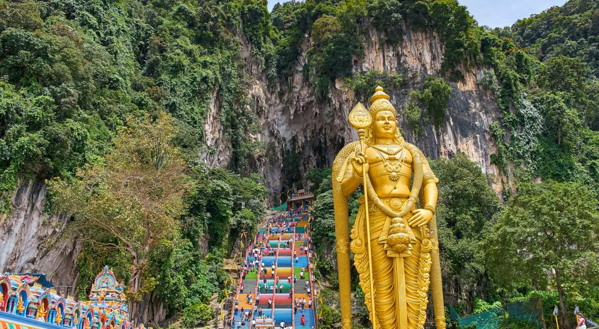 272 colorful stairs lead up to the Batu Caves with the Lord Murugan Statue, 42m tall, in the foreground