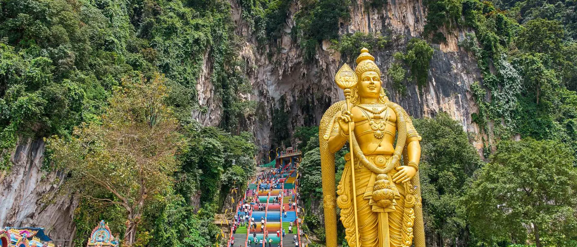 272 colorful stairs lead up to the Batu Caves with the Lord Murugan Statue, 42m tall, in the foreground
