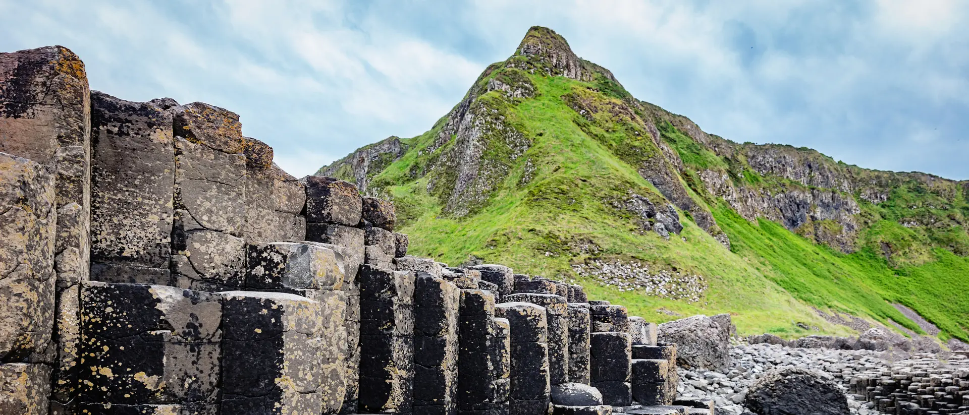 Northern Irealnd Beautiful Giants Causeway Volcanic Landscape with famous Hexagonal Basalt Columns under dramatic skyscape