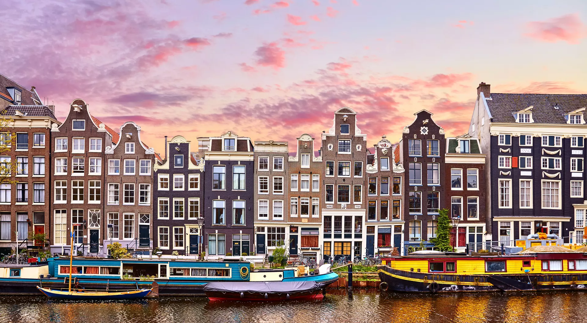 Floating Houses and houseboats and boats at channels by banks