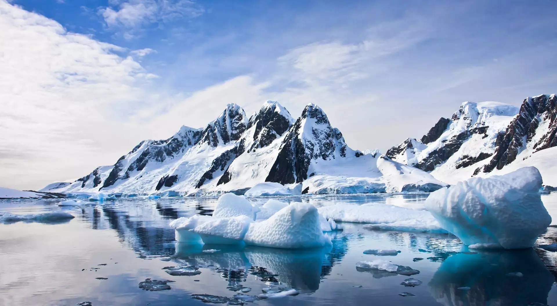 Beautiful snow-capped mountains against the blue sky in Antarctica