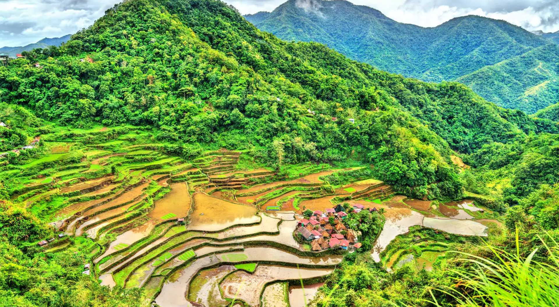 Bangaan Rice Terraces, Luzon Rice Terraces with rolling mountains in the background