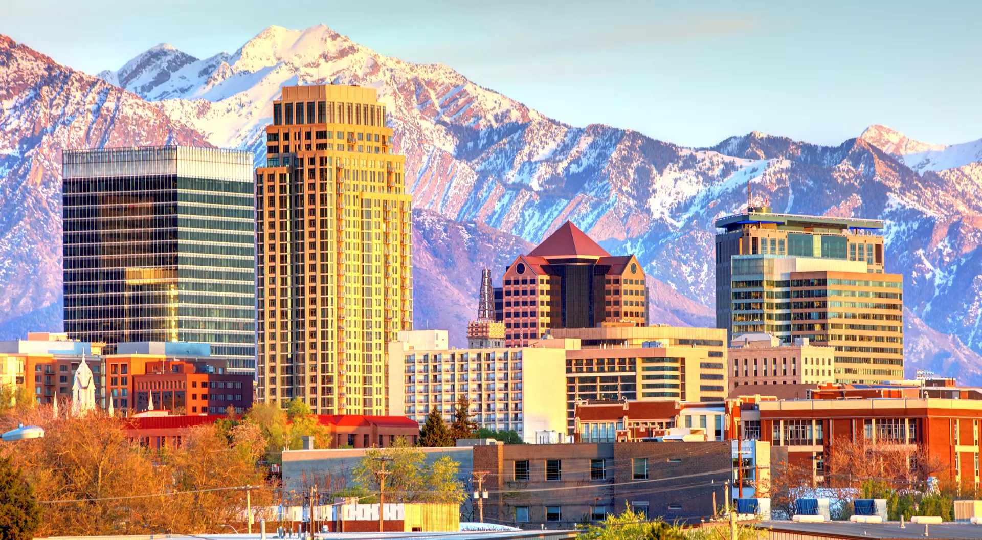 City skyline against the Wasatch Mountains in the background