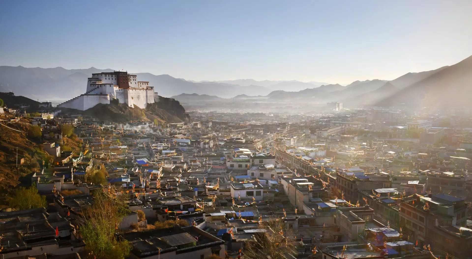 Samzhubzê District Cityscape of Tibet's second largest city Shigatse - dominated by the Dzong and distant Himalayan mountains Samzhubzê District