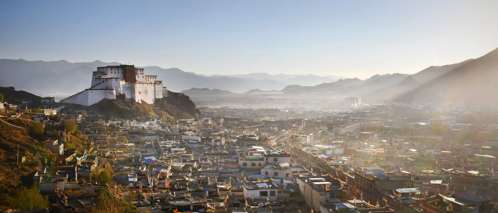 Samzhubzê District Cityscape of Tibet's second largest city Shigatse - dominated by the Dzong and distant Himalayan mountains Samzhubzê District