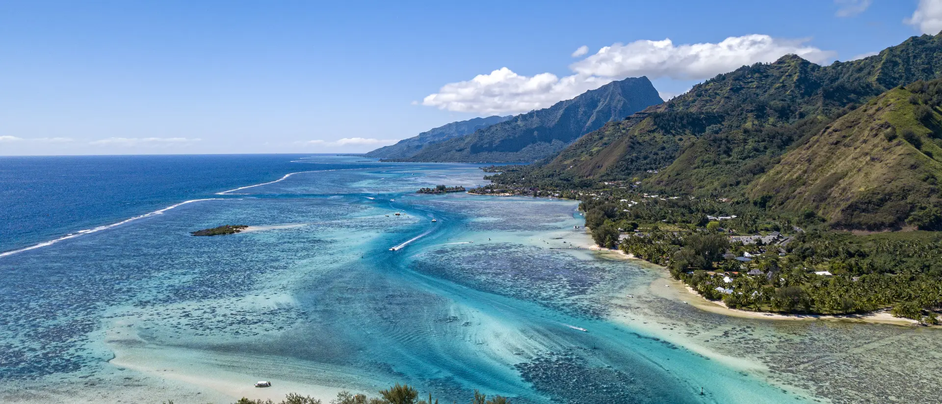 Moorea Lagoon aerial view panorama landscape of ocean coastline and mountains