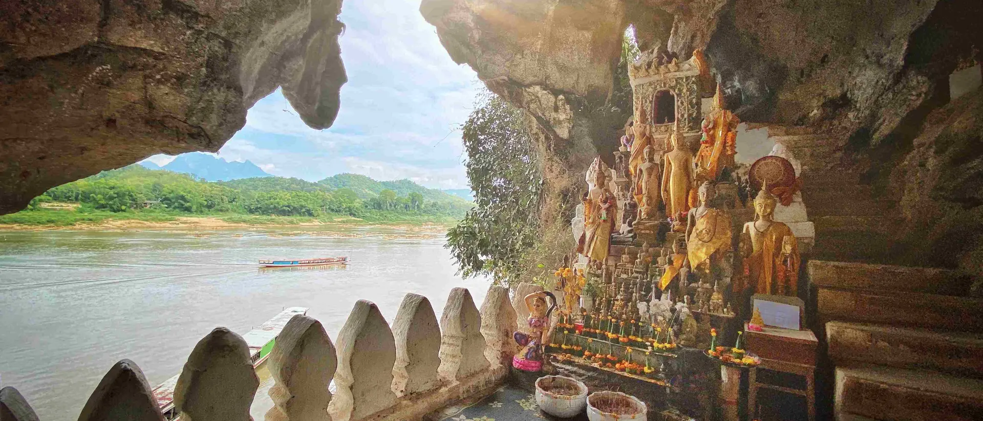 Sunbeam into the Pak Ou Cave Buddha Shrine at Tham Ting Buddhist Cave. Mekong River, Luang Prabang, Laos