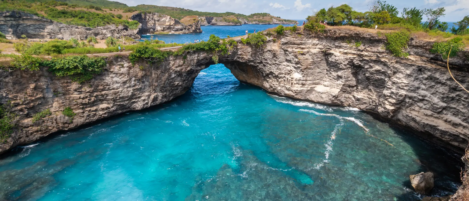 Stone arch over the sea called Broken beach on Nusa Penida ,Indonesia
