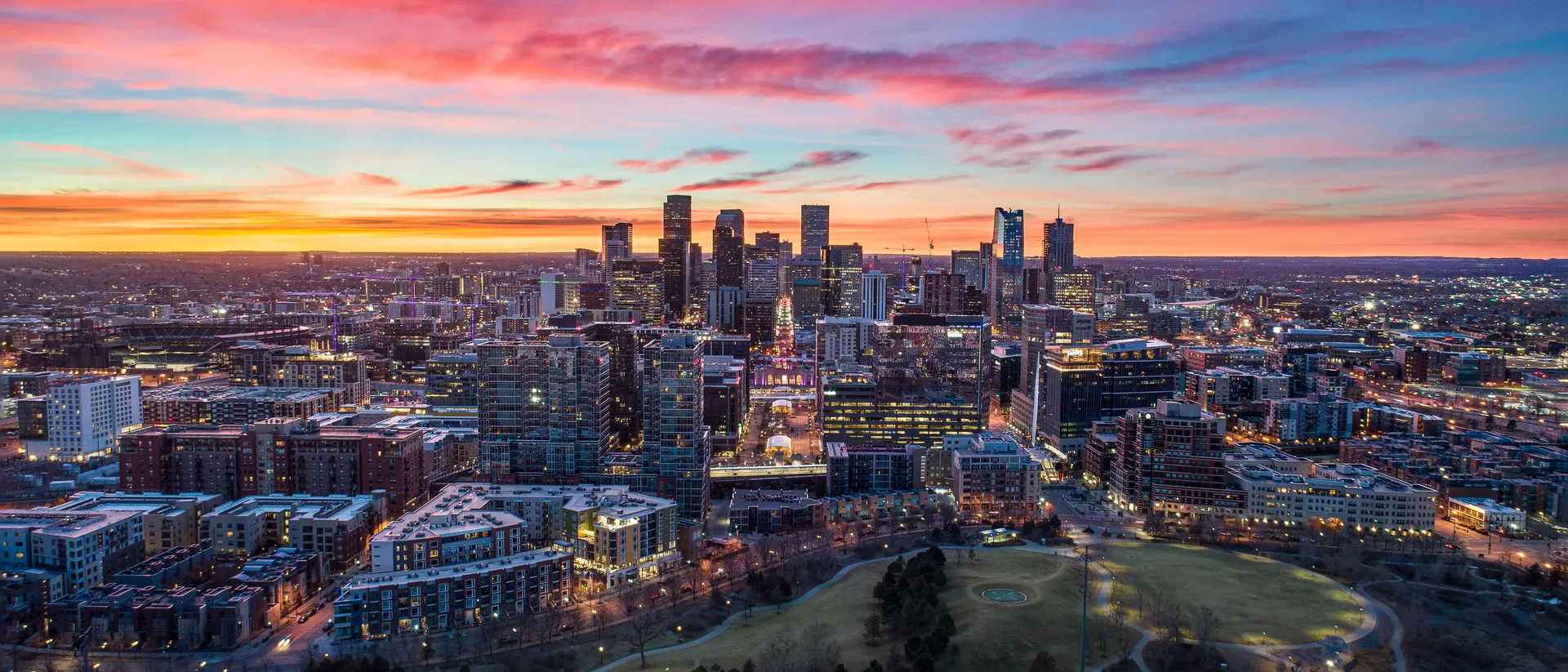 Denver United States Skyline Aerial Panorama taken by drone during vibrant sunset.