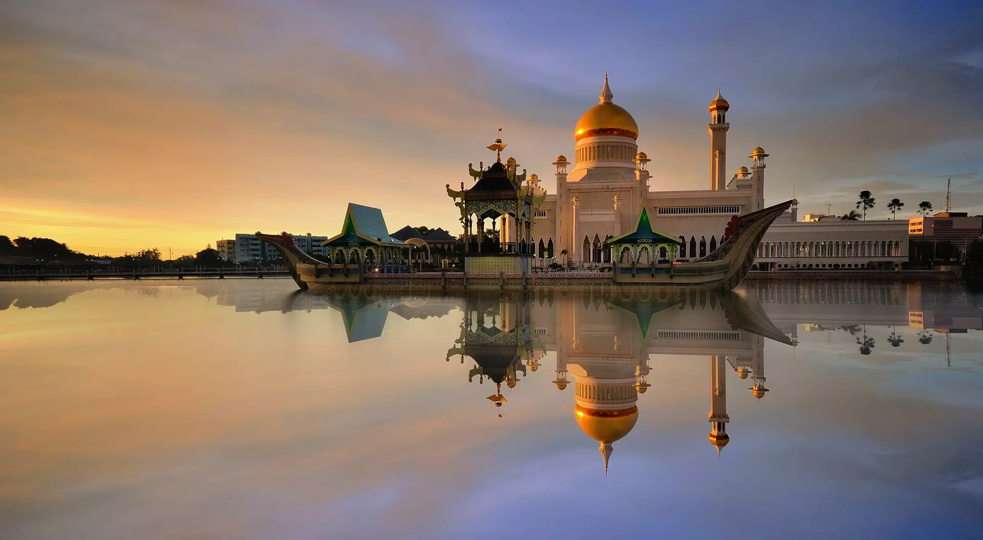 Sunset view of Sultan Omar Ali Saifudding Mosque, Bandar Seri Begawan, Brunei, Southeast Asia with reflection in water