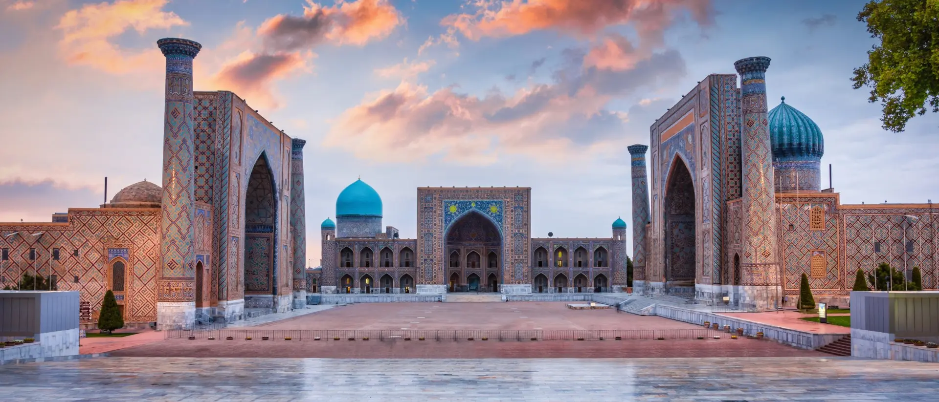 Samarkand Registan Square Samarkand Registan Square with Sher-Dor, Ulugh Beg and Tilya-Kori Madrasahs under colorful moody sunset twilight cloudscape